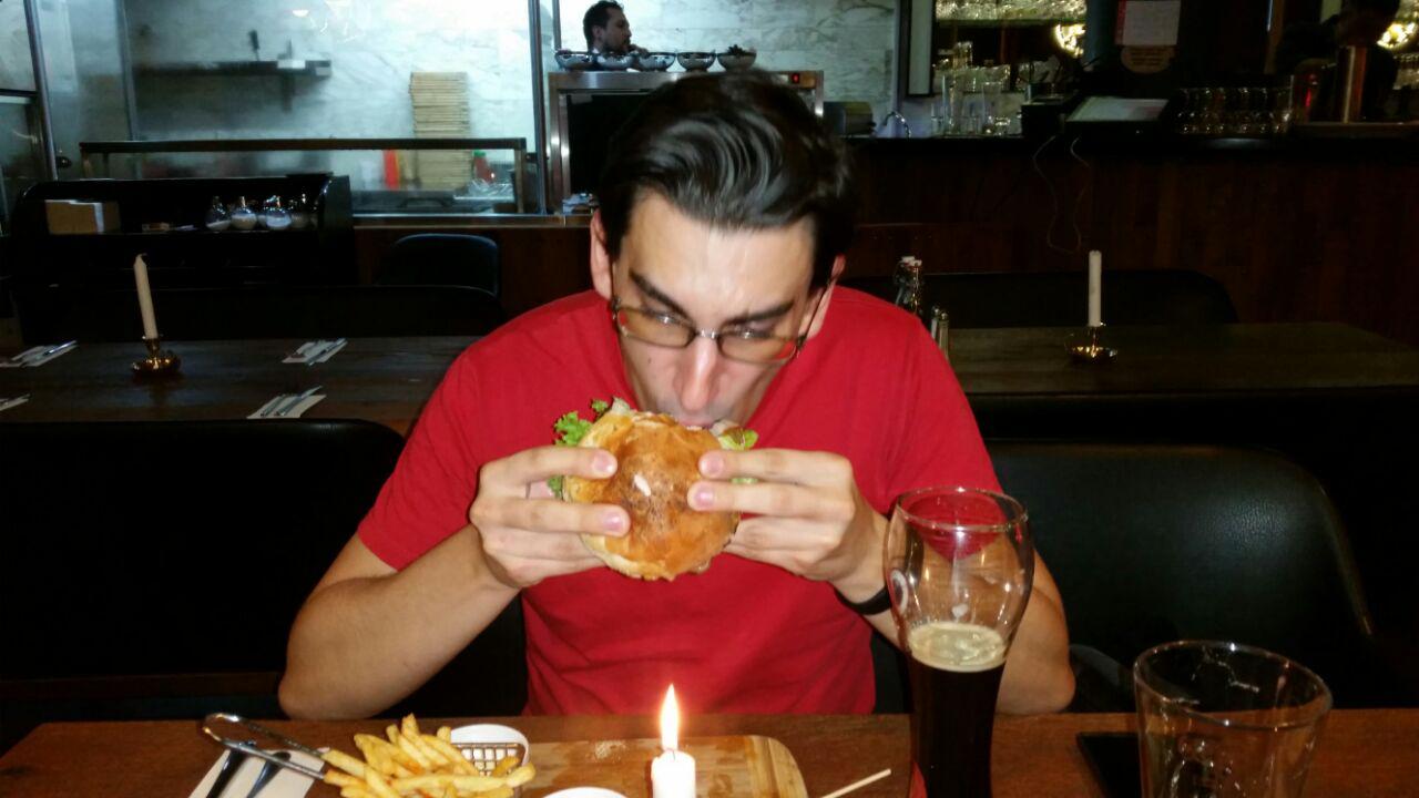 Stuff face with burger